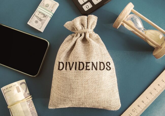 Money Bag With The Word Dividends. Payment Made By A Corporation